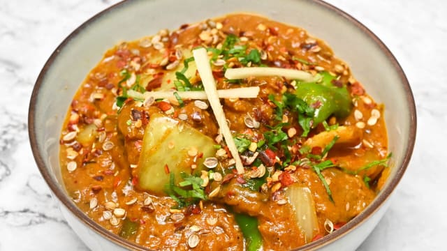 (LAMB KADHAI ) LAMB COOKED WITH DICES OF ONION, & CAPSICUM ALONG WITH MILD SPICED GRAVY TOPPED WITH  GREEN CORIANDER.