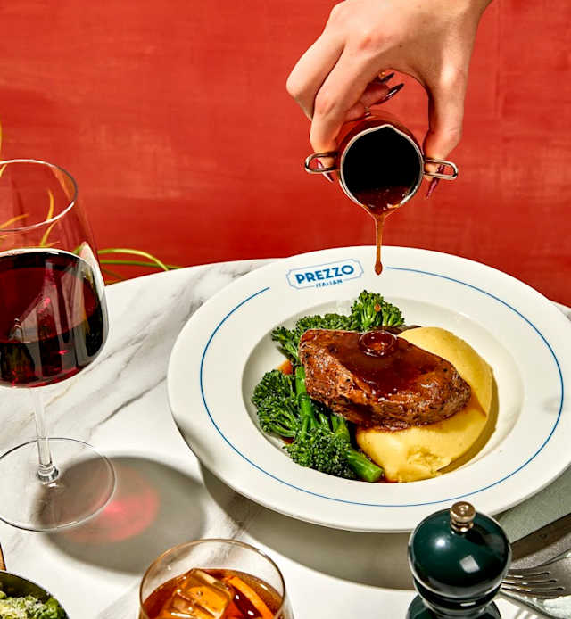 Succulent beef drizzled with rich sauce, served with creamy mashed potatoes garnished with herbs and tender broccoli florets.