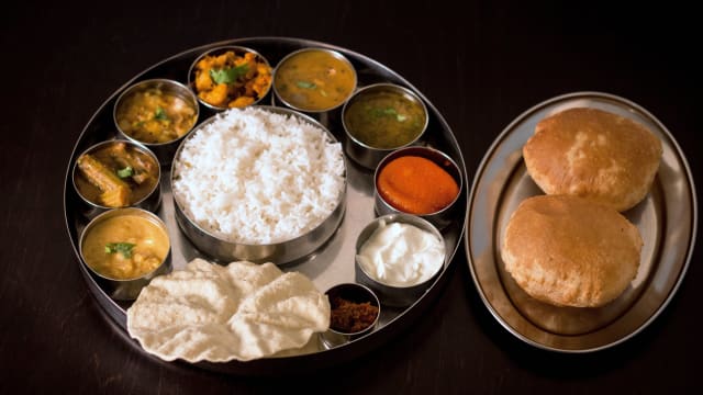 Authentic South Indian Thali combinatio of various veg curries, soups and desert a complete meal
