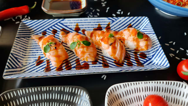 Flamed salmon nigiri sushi