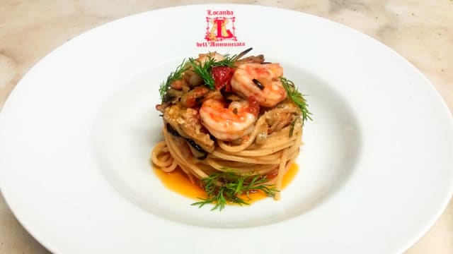 Spaghetti di melanzane al ragout di pesce