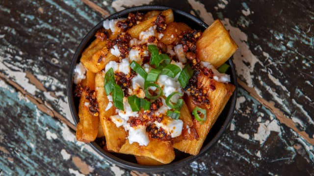 Yukas Bravas: cassava, feta, chili crisp, chives 